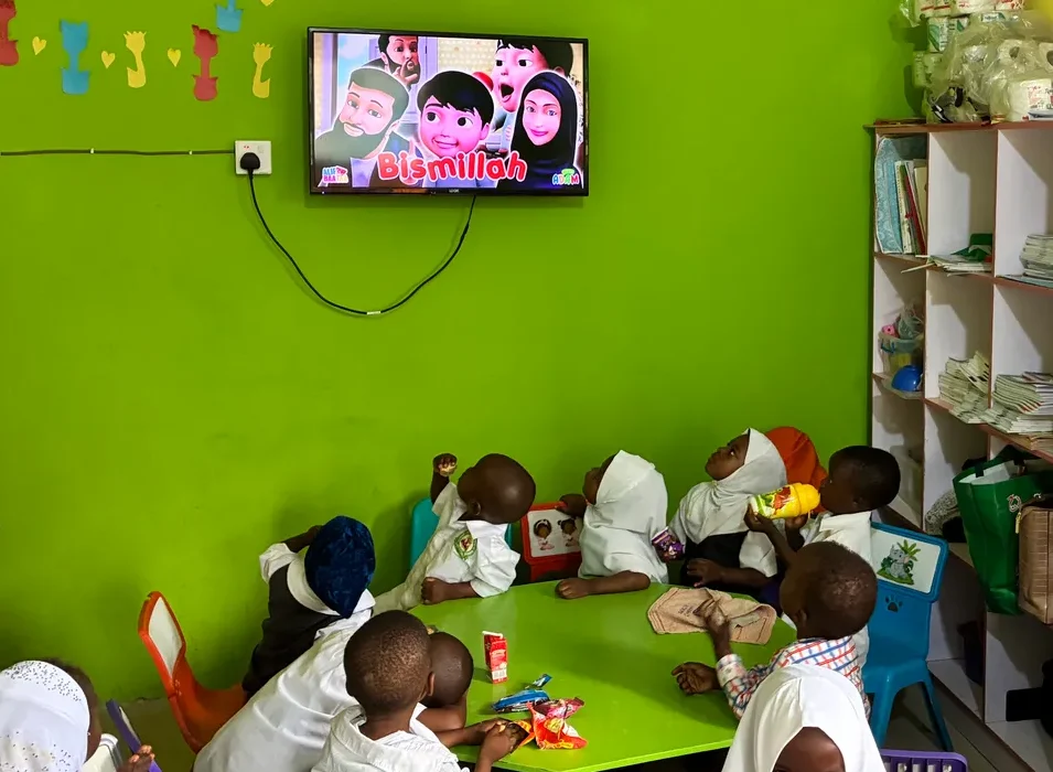 Early years pupils watching an Islamic learning video