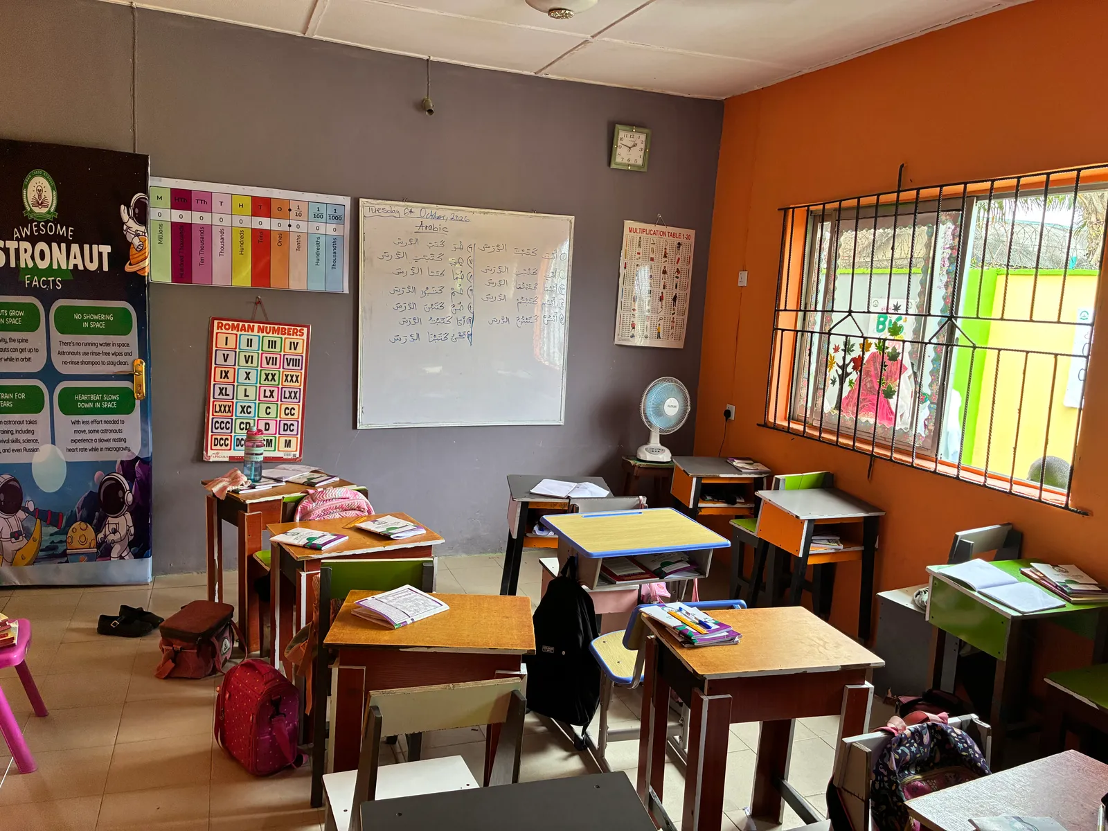 A primary classroom with an Arabic lesson on the whiteboard